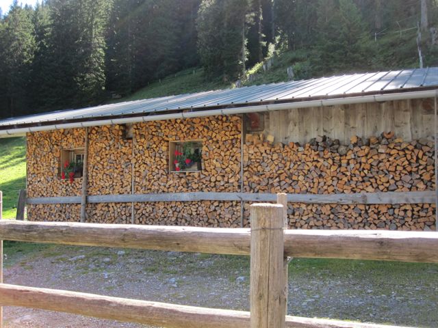 Firewood doubles as insulation for the farmhouse.  The windows have little pockets framed out so that they don't get covered by the firewood.  It gets cold in the mountains, even in September.