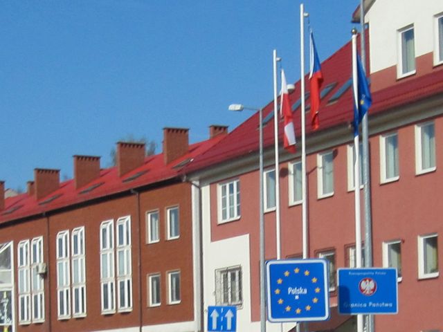 Polish, Czech and EU flags at the border