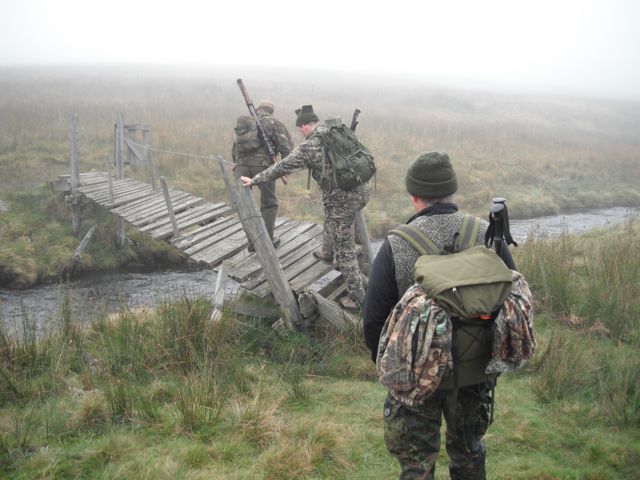 Monday, 11 October:  The first group of hunters takes to the hills.  Peter, Bernd, Joerg ][, & I cross a rickety bridge over a burn (creek or water course) one at a time.