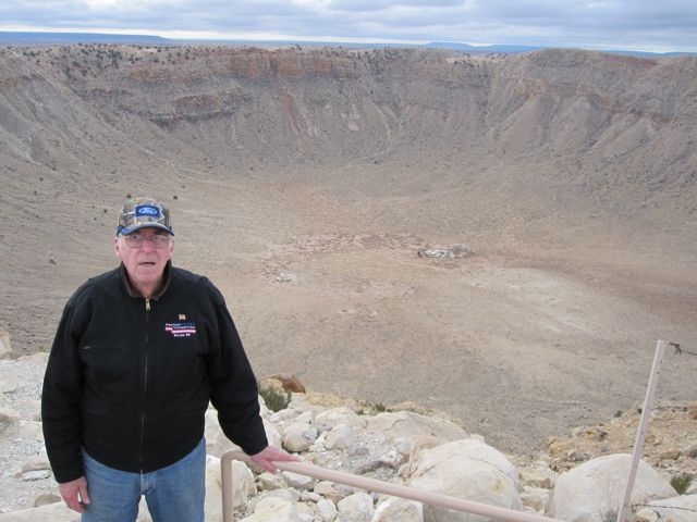 The crater.  Dale for scale.  The hole is 4,000 feet across.  How big is that?  Follow along.  See that white spot on the floor of the crater, past dad's shoulder?  Look at the next photo