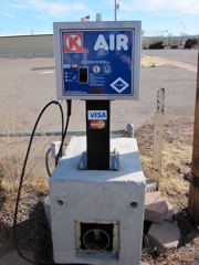 $.75 for air.  They take credit cards.  The money box (for quarters) is cast concrete and armored steel.