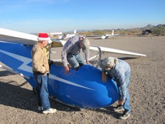 Climbing aboard.  His pilot had a Santa Hat, and 18,000 flights in gliders...  Yes, 18,000.