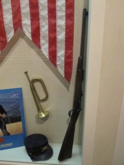 Bugle, pennant, kepi and Springfield Carbine