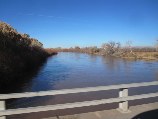The brown river waters flowing toward Texas and eventually the Gulf of Mexico.